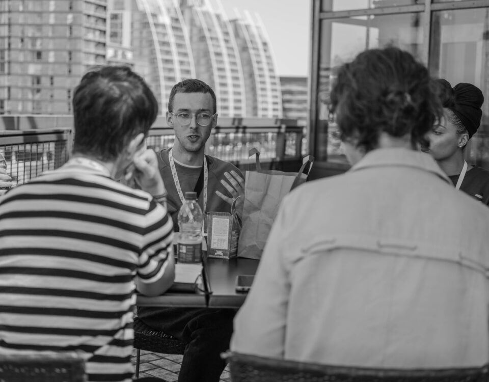 Young professionals sat around a table and planning.