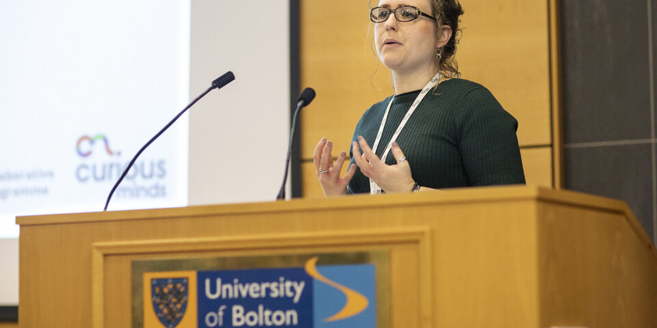 Holly presenting to a group of young people about digital creative career opportunities at the University of Bolton.